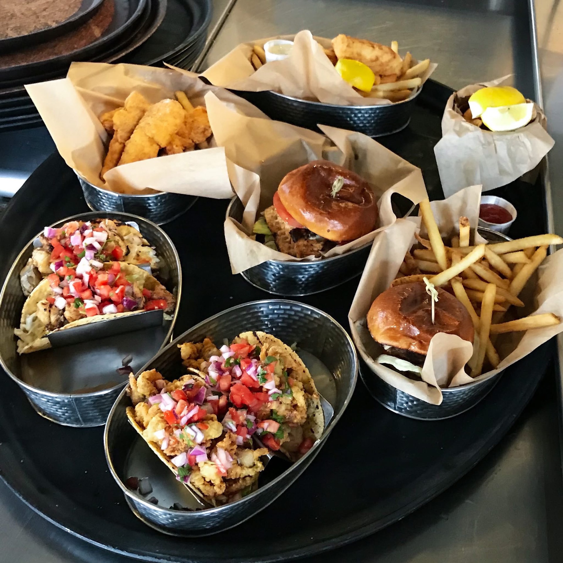 Fish tacos and smashburgers with fries